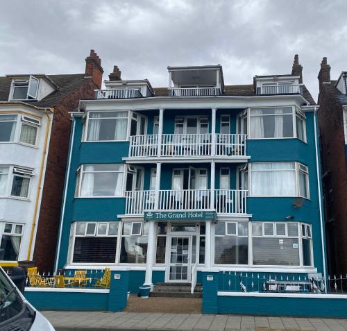 a blue building with a balcony on top of it at Guest Suite at The Grand Hotel in Skegness