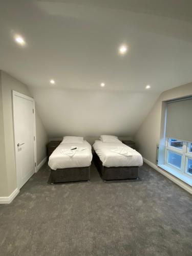 Postel nebo postele na pokoji v ubytování Cavendish Apartments