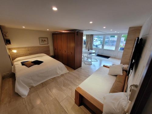 Ένα ή περισσότερα κρεβάτια σε δωμάτιο στο Studio Verde