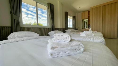 Ένα ή περισσότερα κρεβάτια σε δωμάτιο στο Chillax Poolvilla Songkhla