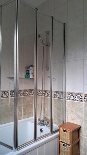 a shower in a bathroom with a bath tub at 28 Clifford Road in Whitstable