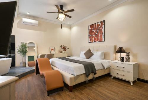 a bedroom with a large bed and a bathroom at The Passion Lux Airport Hotel Apartment - Free Airport in Ho Chi Minh City
