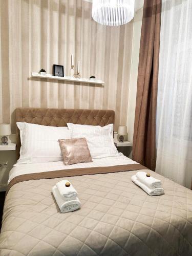 Postel nebo postele na pokoji v ubytování L&O Residence Gold