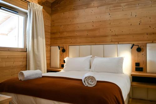 Ένα ή περισσότερα κρεβάτια σε δωμάτιο στο Chalet Chinaille A2 – L’Écrin du Grand-Bornand