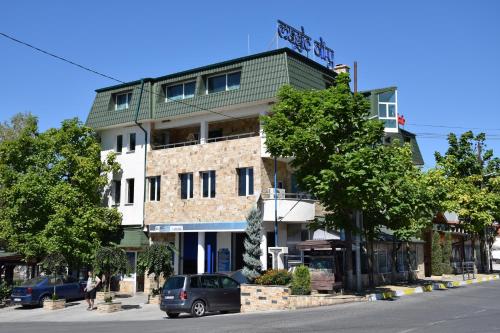 a building on the side of a street at Guest Rooms Lina in Kirkovo