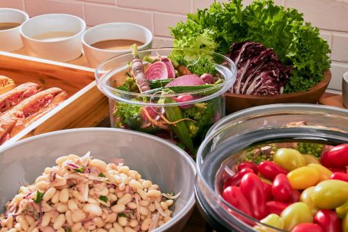a bunch of different types of vegetables in bowls at edit x seven SETOUCHI SHODOSHIMA in Shodoshima