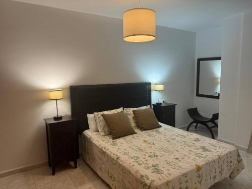 Voodi või voodid majutusasutuse Cava Suite in Charco San Gins toas