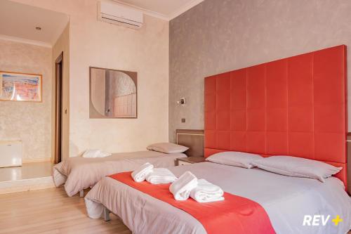 Ένα ή περισσότερα κρεβάτια σε δωμάτιο στο New Inn