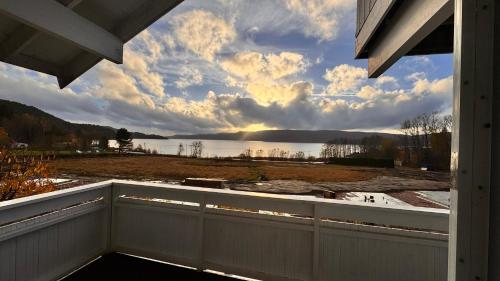 a view from the porch of a house overlooking a lake at Rørvikjordet 12 flott hus ved utsikt in Drammen