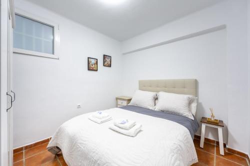 Ένα ή περισσότερα κρεβάτια σε δωμάτιο στο AlmeriaSuite Casa de Luz