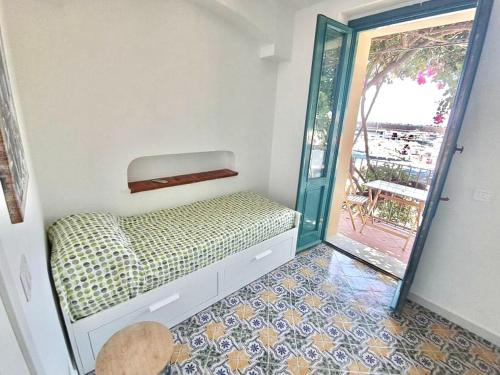 Postel nebo postele na pokoji v ubytování La Perla del Porto di Maratea House