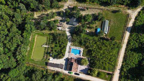 an aerial view of a house with a field and trees at Ranč Lipe in Orašje