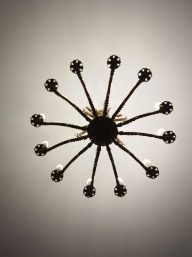 a close up of a chandelier hanging from the ceiling at K17 mini hotel in Tbilisi City