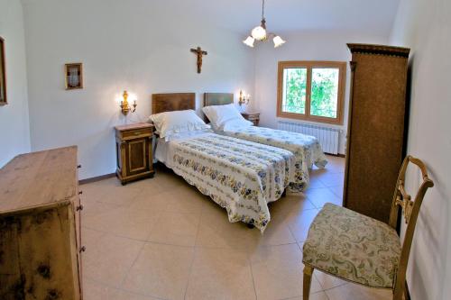 Ένα ή περισσότερα κρεβάτια σε δωμάτιο στο Podere Riosto Cantina&Agriturismo