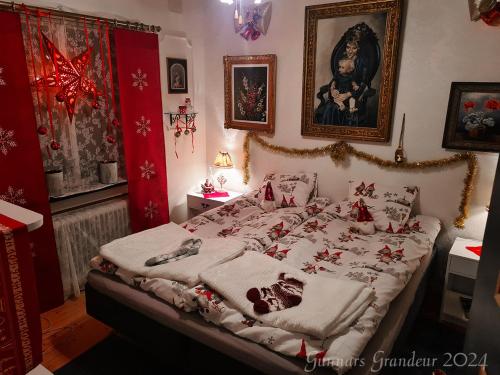 a bedroom with a large bed with christmas decorations at Romantic get-away in Mölnlycke