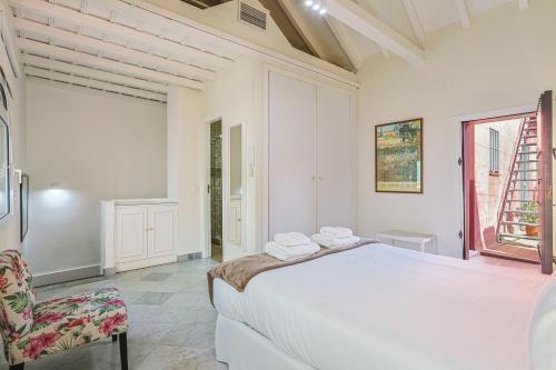 Ένα ή περισσότερα κρεβάτια σε δωμάτιο στο Casa Palacio Guiomar by SHS