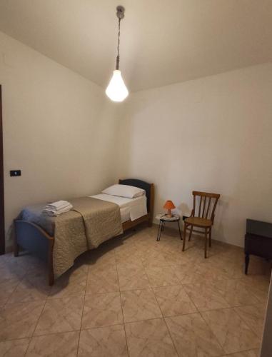 a room with a bed and a table and a chair at Guesthouse Matese in Piedimonte dʼAlife