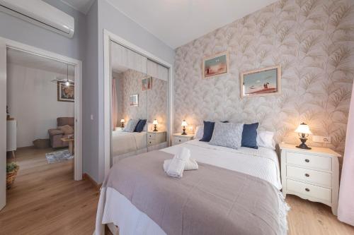 a bedroom with a large bed in a room at Iconic Center in Seville