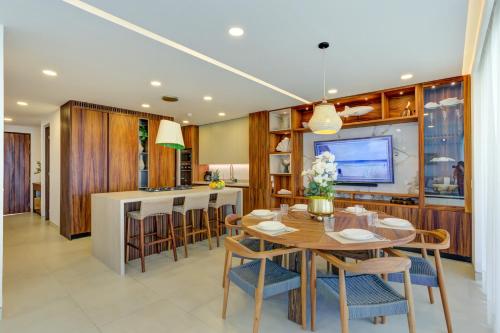 a dining room and kitchen with a table and chairs at Vista Natura, Luxury Home Near the Beach in Nuevo Vallarta