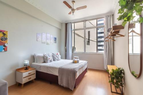 Ένα ή περισσότερα κρεβάτια σε δωμάτιο στο Aconchego no Flamengo - SV808