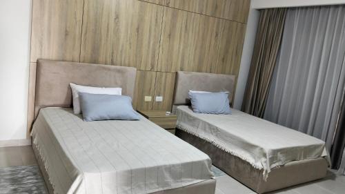 two beds in a room with two pillows at كابيلا شرم الشيخ جنوب سيناء in Sharm El Sheikh