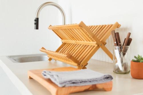 a wooden towel holder sitting on a counter next to a sink at Downtown SURF SHACK- steps from main surf break in Sayulita