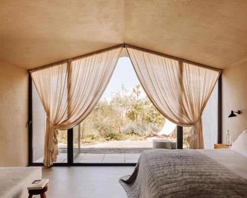 Postel nebo postele na pokoji v ubytování Pa.te.os