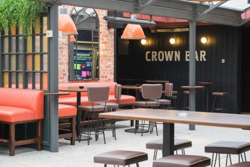 a group of tables and chairs in a restaurant at Crown Quarter in Wexford