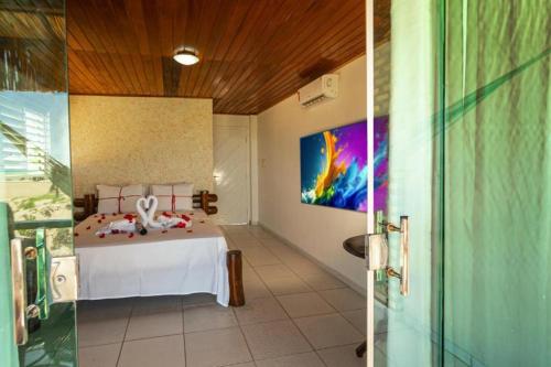 Ένα ή περισσότερα κρεβάτια σε δωμάτιο στο Pousada Arte do Velejo by Solarium