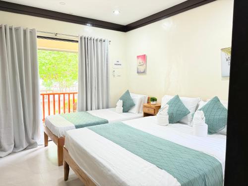 Postel nebo postele na pokoji v ubytování The Cove Resort Siquijor