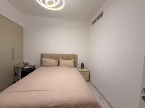 Ένα ή περισσότερα κρεβάτια σε δωμάτιο στο Dubai Hills Mahek Holiday Villa