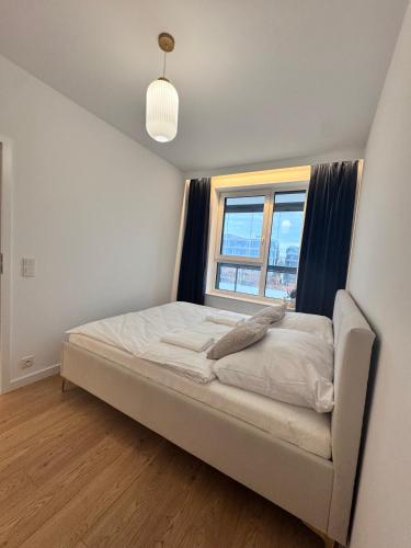 Postel nebo postele na pokoji v ubytování Forest Apart IX Aleje Jerozolimskie