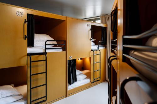 a group of bunk beds in a room at The People Lyon Hostel in Lyon