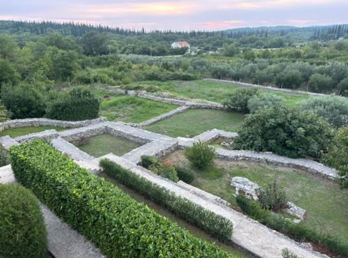 an aerial view of a garden with bushes at Villa Oasis Cypress in Čilipi