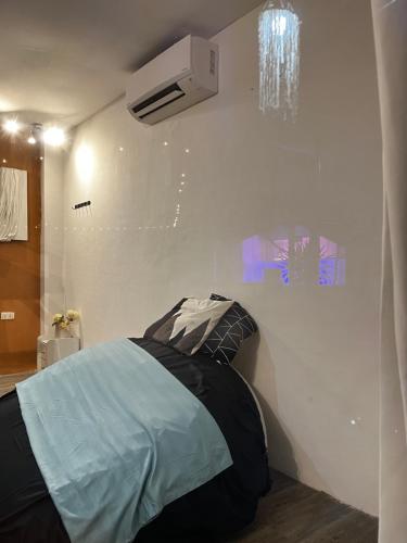 a bedroom with a bed and a ceiling fan at Boxify Cabins 