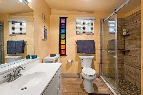 a bathroom with a toilet and a shower and a sink at 47 Creekside Retreat House in Sedona