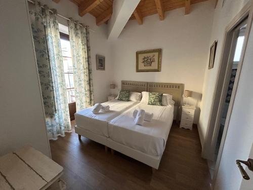 Postel nebo postele na pokoji v ubytování Patios de la Riva