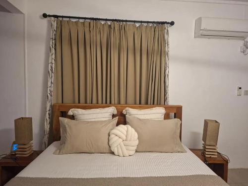 Postel nebo postele na pokoji v ubytování Charming House with Mountain View - Trou d'Eau Douce