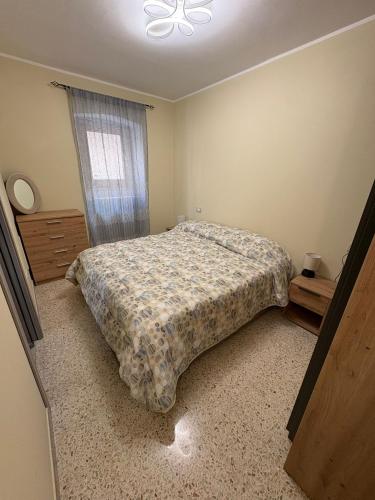 a bedroom with a bed and a window at Il Cardellino in Castel di Sangro