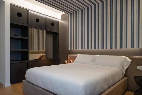 En eller flere senge i et værelse på Villa Galentino Suite Room