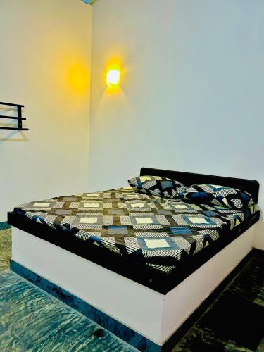 Ένα ή περισσότερα κρεβάτια σε δωμάτιο στο Batawala PARADIES inn