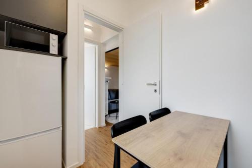 Køkken eller tekøkken på Cozy Penthouse with stunning view & balcony