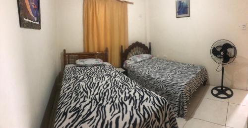 Postel nebo postele na pokoji v ubytování hospedaje Maluli 04