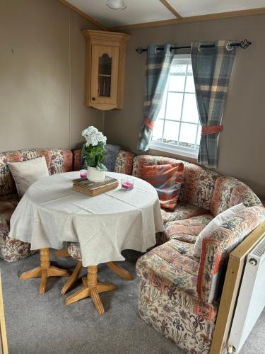 a living room with a couch and a table at My happy place in Greencastle