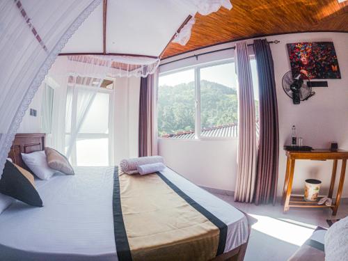 Postel nebo postele na pokoji v ubytování Pearl Vista Ella