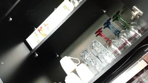 a shelf with a sink and toilet paper on it at Modern 3BR Sea & Mountain View Apartment Bouar, Keserwan in Bqāq ad Dīn