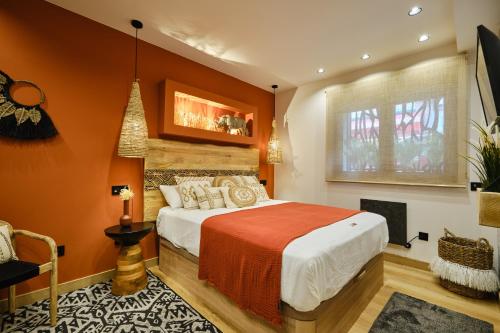 Postel nebo postele na pokoji v ubytování El Samburu - Apartamento Premium inspirado en África - Grupo Querbes