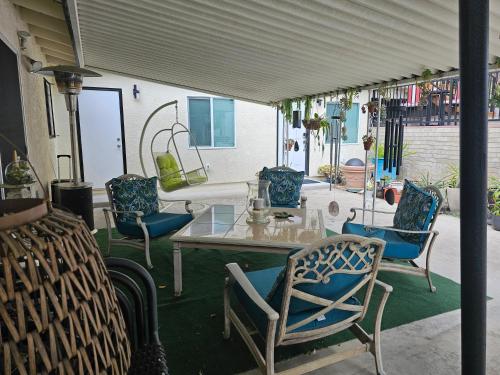 a patio with chairs and a table and a table and chairs at Beautiful new construction 1br with full size appliances centrally located in La Mesa