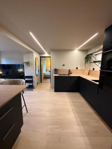 a kitchen with a sink and a counter top at Notodden Luxe two-bedroom Apartment in Notodden