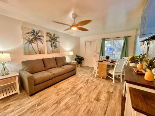 a living room with a couch and a table at Malibu Resort Motel in St Pete Beach